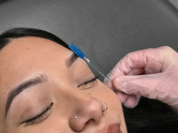 Woman with perfectly groomed eyebrows and smooth skin